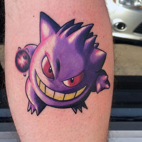 Vibrant Gengar tattoo with glowing red eyes, a wide yellow-to-white grin, and bold purple shading for a striking cartoon finish.