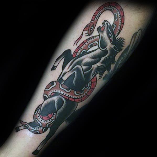 Bold traditional-style tattoo of a rearing black horse wrapped in a red and white snake, placed on the forearm with dramatic contrast