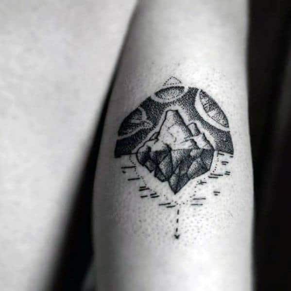 Dotwork iceberg tattoo with cosmic patterns above and fragmented elements below, blending space and nature in a surreal design.