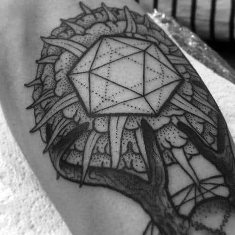 Icosahedron tattoo with dotted detailing, set within a surreal tree-like structure with roots and abstract elements surrounding it.