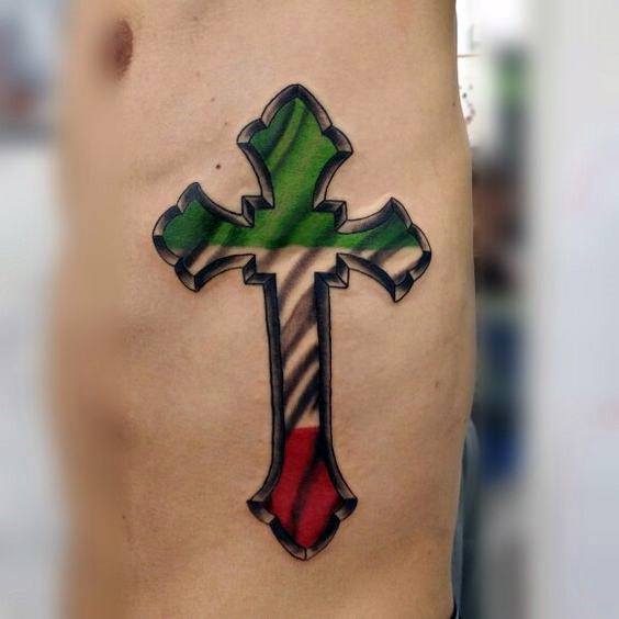 Side rib tattoo of a bold cross filled with the Italian flag colors, symbolizing faith, heritage, and strong cultural pride.