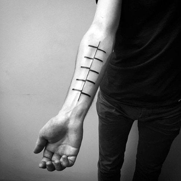Minimalist and abstract ladder tattoo with bold lines, symbolizing progress, ideal for men's inner forearm placement.