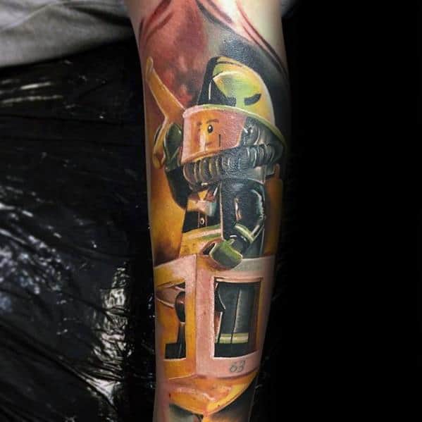 Realistic tattoo of a Lego firefighter in action, wearing a helmet and gear while standing in a lift bucket, with intense shading and detail.