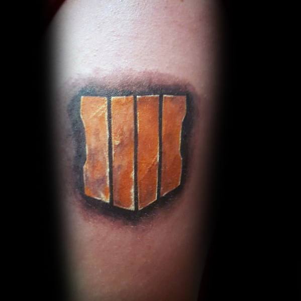 Bold Call of Duty: Black Ops 4 logo tattoo featuring realistic shading and a worn, metallic effect, creating a striking and rugged design.