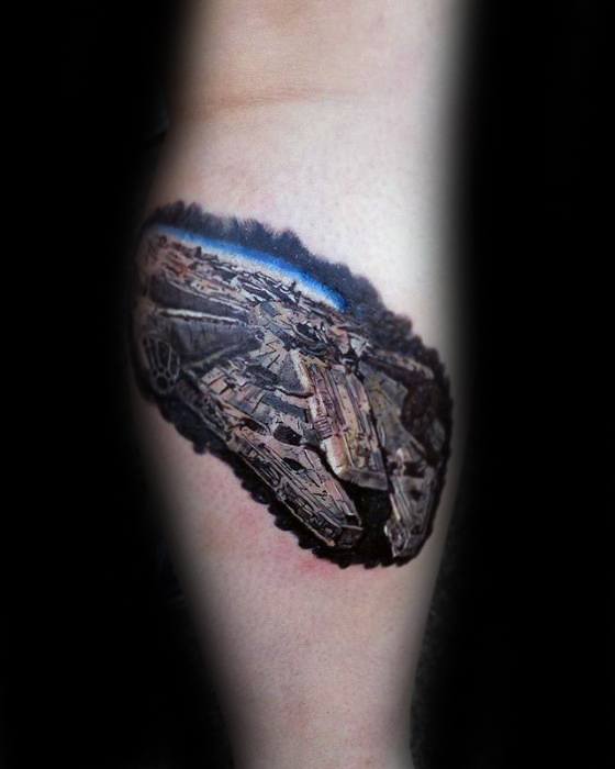 Realistic Millennium Falcon tattoo in flight, with a vivid outer space background and high-detail 3D shading on the forearm.