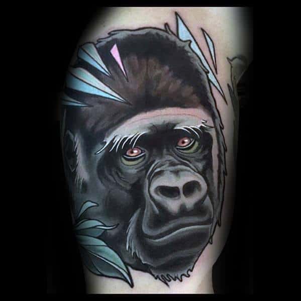 Neo-traditional gorilla tattoo with a calm expression, soft shading, pastel leaf accents, and a clean illustrative style.