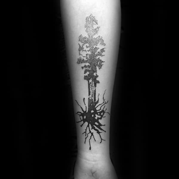 Forearm tattoo of a neuron transforming into a tree, with a dark cell body at the base and detailed dotwork forming the leafy top.