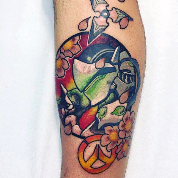 Colorful tattoo of Genji from Overwatch with cherry blossoms, shuriken, and the Overwatch logo on the forearm.
