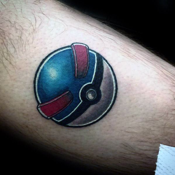 Ultra Ball tattoo with clean shading and bold lines, featuring a sleek blue and red color scheme on the forearm.
