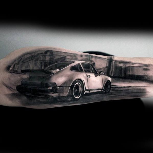 Dynamic Porsche tattoo depicting a realistic car driving through a blurred cityscape scene.
