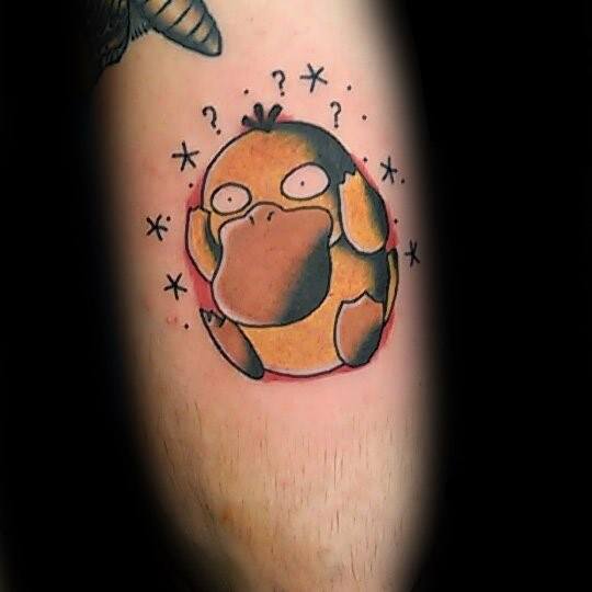Classic Psyduck tattoo with a dazed look, surrounded by stars and question marks, placed on a man's calf.