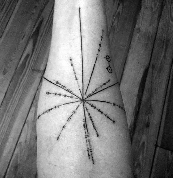 Black tattoo on skin depicting a radial pulsar map with lines and dots, set against a wooden floor background