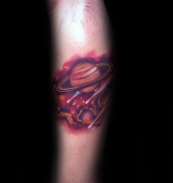 Vibrant Saturn tattoo design for men with fiery red and orange cosmic clouds and bright planetary rings in a glowing outer space scene.