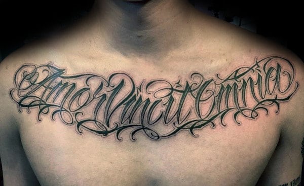 Masculine Script Tattoo On Male With Black Ink On Upper Chest