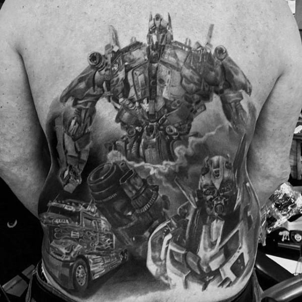 Masculine Shaded Black And Grey Guys Themed Transformers Tattoo On Back