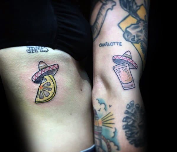 Matching tequila-themed tattoos featuring a shot glass and a lemon wedge, both topped with a sombrero, creating a fun and playful design.