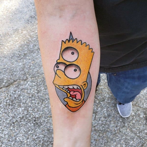 Creative tattoo of Bart Simpson with three eyes, blending his face with Homer’s for a surreal and unique design on the forearm.