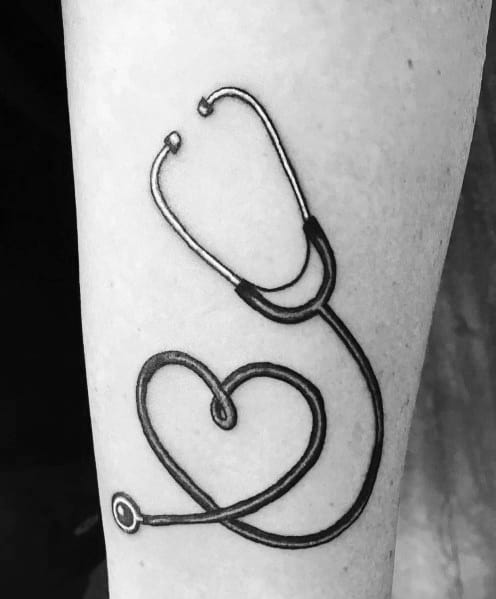 Stethoscope tattoo forming a heart shape, representing compassion, care, and dedication to the medical profession.