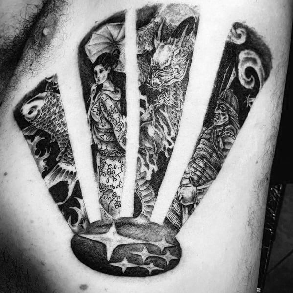 Intricate black and grey Subaru-themed tattoo featuring the Subaru logo as a base, with Japanese-inspired elements including a geisha, samurai, and mythical creature.