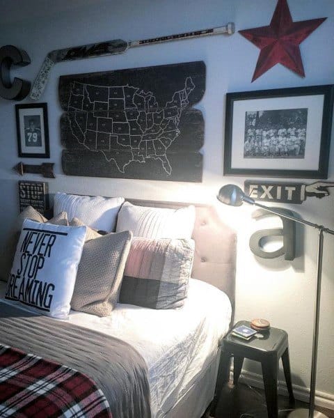 Baseball-themed bedroom with U.S. map, vintage decor, and "Never Stop Dreaming" pillow.