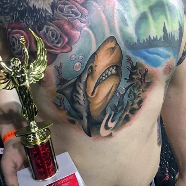 Realistic tiger shark chest tattoo with dramatic lighting, coral reef elements, and detailed shading, blending sea life with artistic depth.