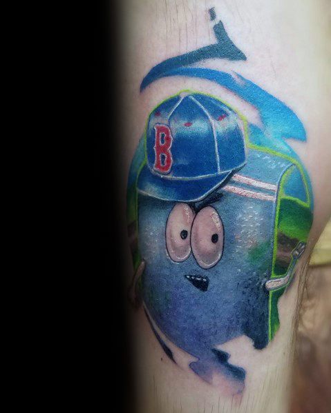 Realistic South Park tattoo of Towelie wearing a blue baseball cap, featuring vibrant shading and a soft, textured appearance.