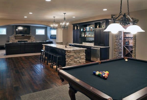 modern man cave billiard table wet bar wood floors leather couch 