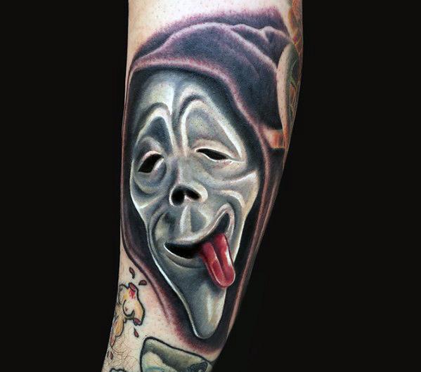 Realistic color tattoo of the parody Ghostface mask from *Scary Movie*, featuring exaggerated facial details and a playful tongue-out expression.