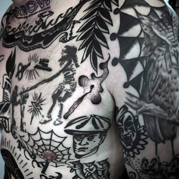 Blackwork matchstick tattoo with rising smoke, seamlessly integrated among bold traditional-style chest and shoulder tattoos, symbolizing fleeting intensity or a moment that sparked change.