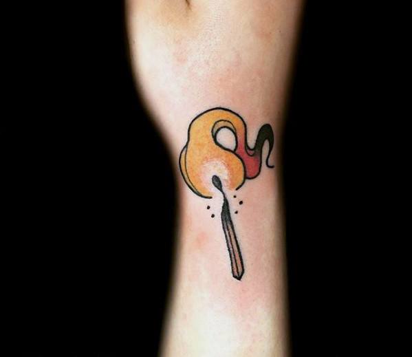 Minimalist burning match tattoo with soft orange and red flame, symbolizing warmth, inspiration, or a spark of creativity.