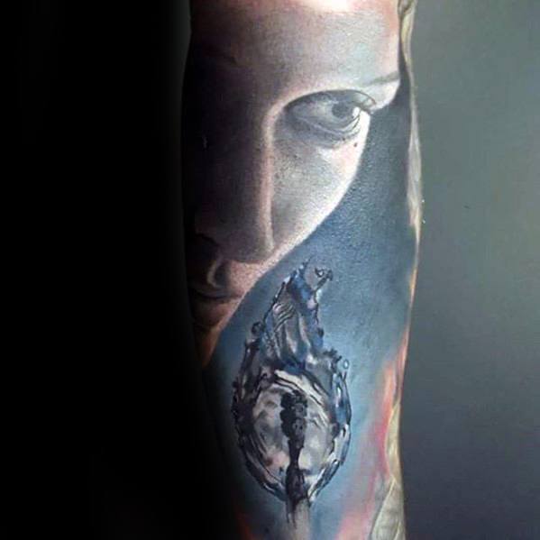 Hyper-realistic tattoo featuring a woman's face gazing at a burning match with a skeletal figure in the flame, symbolizing introspection, mortality, and inner fire.