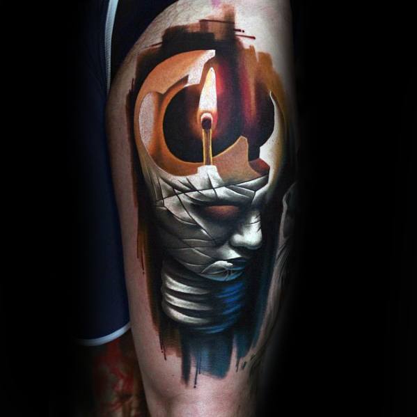 Hyper-realistic and abstract tattoo of a wrapped face with a lit match as the third eye, symbolizing inner awakening, mental ignition, and hidden power.