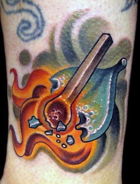 Vibrant tattoo of a burning matchstick with colorful abstract flames and bubbling effects, symbolizing explosive energy, passion, and creativity.