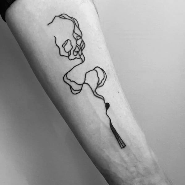 Fine line tattoo of a burnt matchstick with smoke forming a skull, symbolizing danger, mortality, or the cost of burning out.
