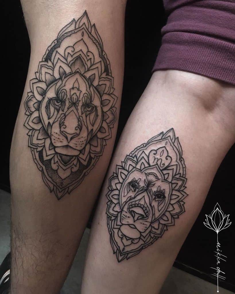 Matching mandala-style lion and lioness tattoos on legs, featuring intricate linework, symmetrical patterns, and bold black ink details.