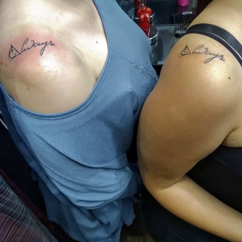 Matching shoulder tattoos featuring 'Always' in cursive with the Deathly Hallows symbol, symbolizing eternal bond and loyalty