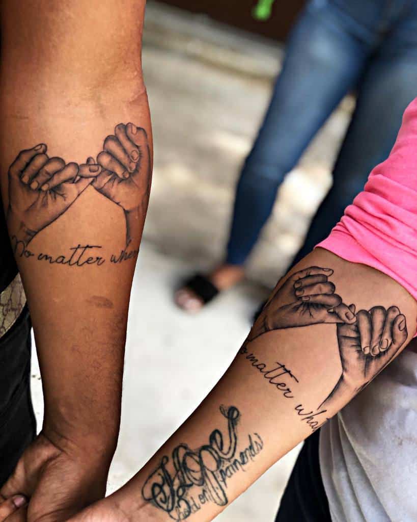 Matching pinky promise tattoos with realistic hand shading and the phrase "no matter what" in cursive, placed on the forearms