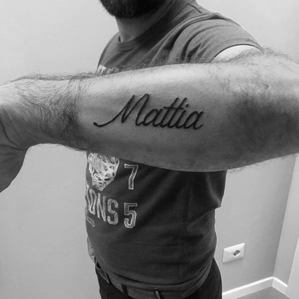Mattia Outer Forearm Cursive Guys Name Tattoos