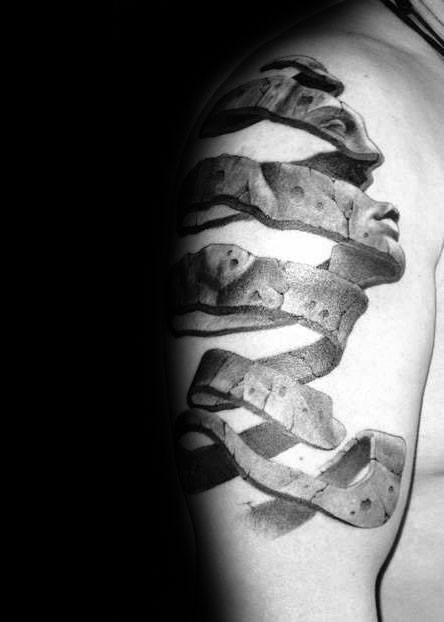 MC Escher-inspired upper arm tattoo of a 3D ribbon unraveling into realistic faces, blending surrealism with sculptural illusion.