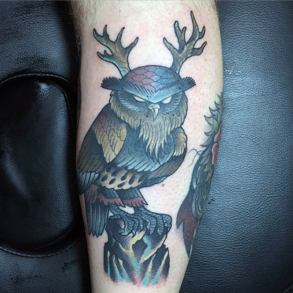 Mean Looking Owl With Antlers Mens Arm Tattoo Design Ideas