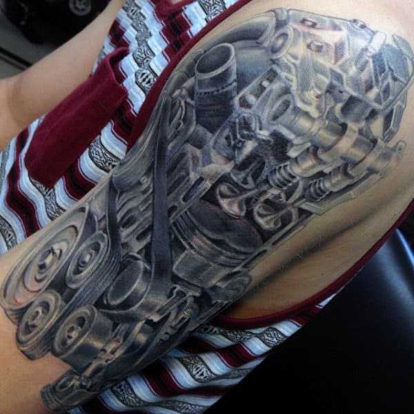 Tattoo of a mechanical design on an upper arm