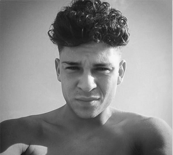 Medium Length Mens Curly Undercut Haircut