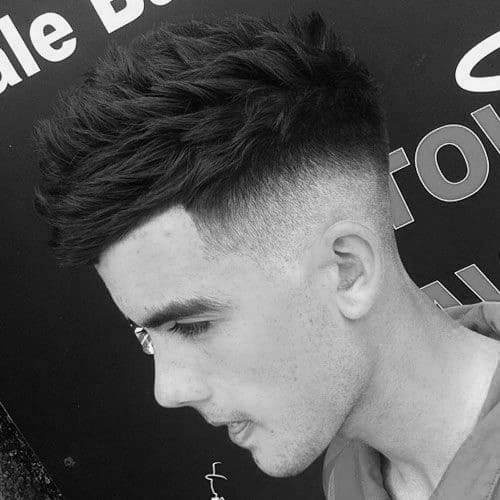 Medium-length, tousled top with a high skin fade on the sides and back