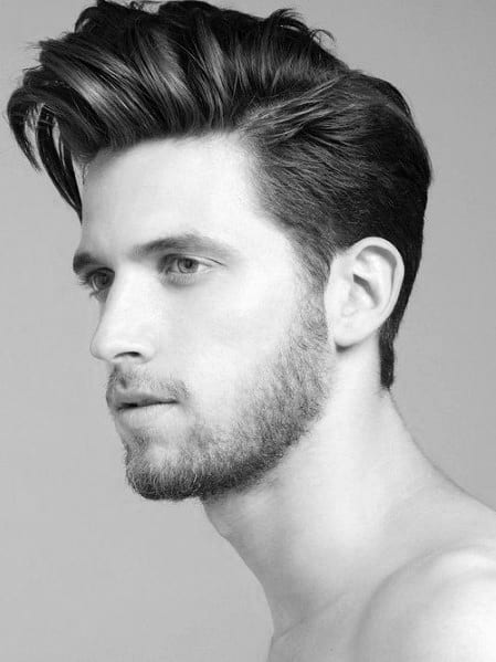Voluminous, medium-length quiff with a subtle side part