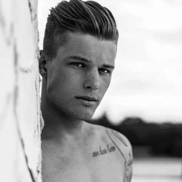 Medium Length Slicked Back Hair With Fade Side