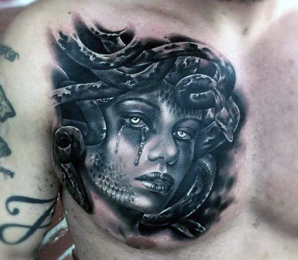 Black and gray chest tattoo of Medusa with snake hair and crying tears