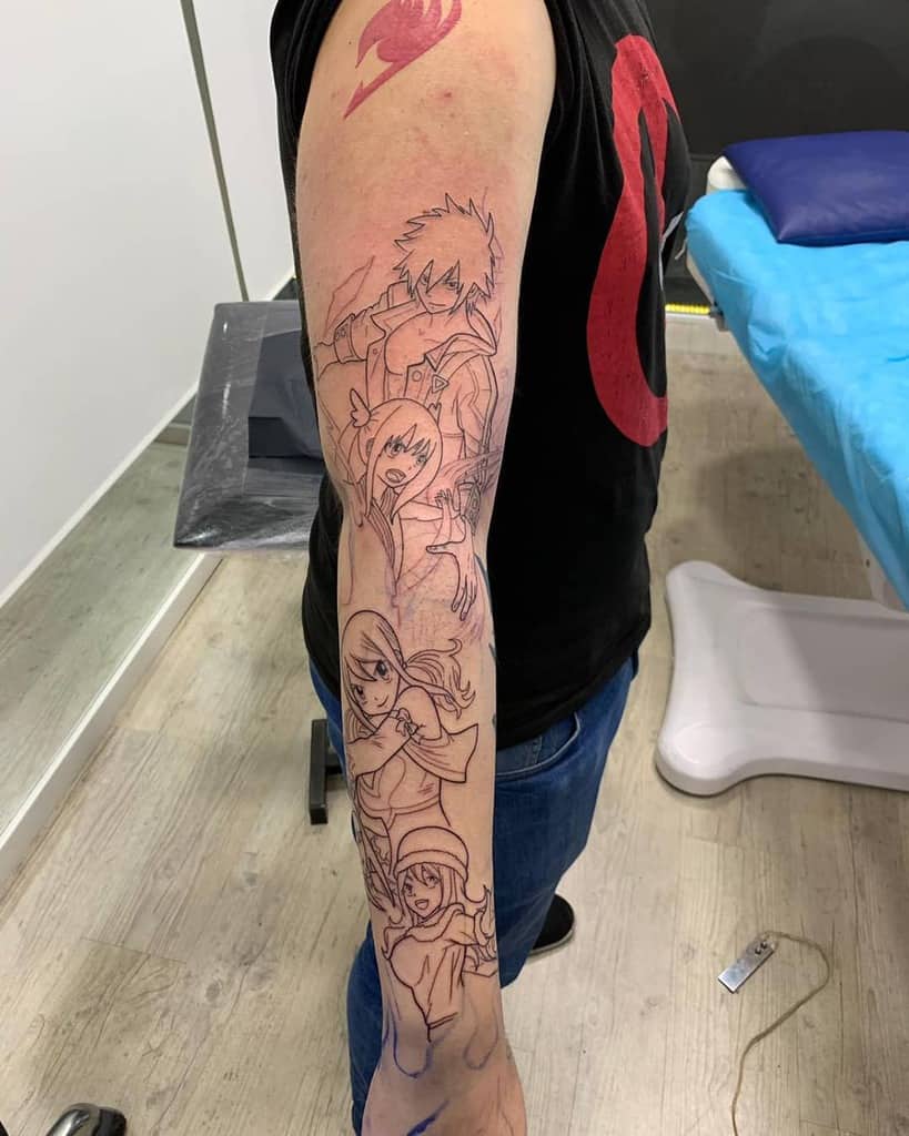 This *Fairy Tail* tattoo sleeve features detailed linework with characters and the guild emblem. Are you adding color or shading?