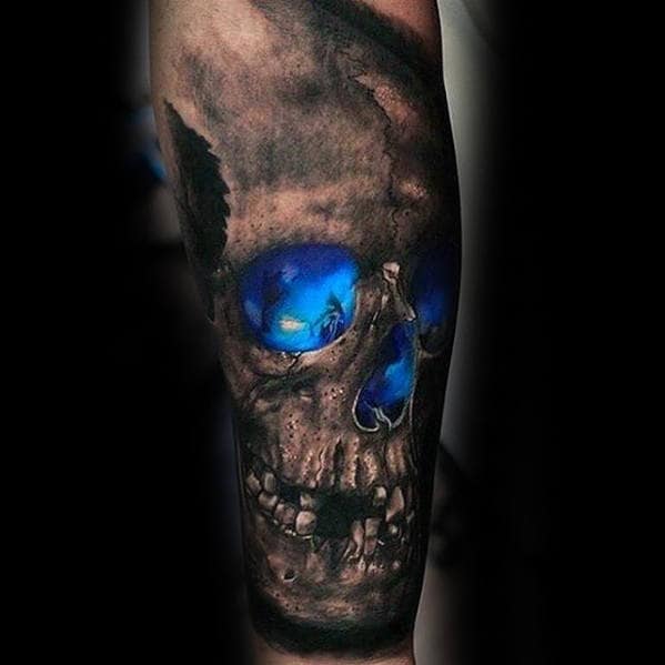 Tattoo of a skull with glowing blue eyes