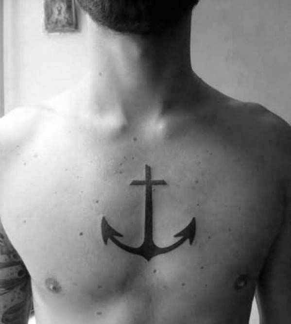 Anchor tattoo with cross on the chest
