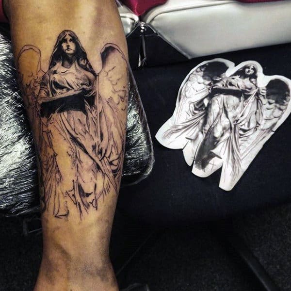 Tattoo of an angel on a person's leg